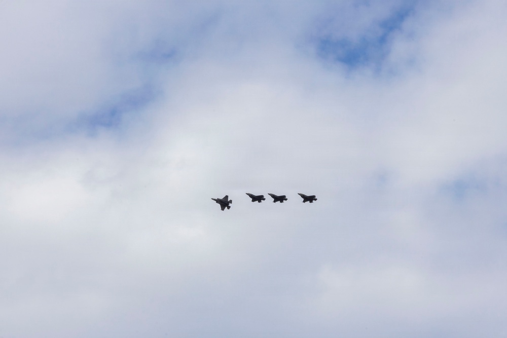 U.S. service members unload ordnance from aircraft participating in exercise Red Flag-Alaska