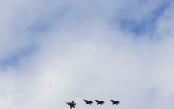 U.S. service members unload ordnance from aircraft participating in exercise Red Flag-Alaska