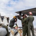 U.S. service members unload ordnance from aircraft participating in exercise Red Flag-Alaska
