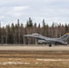 U.S. service members unload ordnance from aircraft participating in exercise Red Flag-Alaska