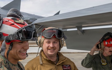 U.S. service members unload ordnance from aircraft participating in exercise Red Flag-Alaska