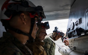 U.S. service members unload ordnance from aircraft participating in exercise Red Flag-Alaska