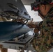 U.S. service members unload ordnance from aircraft participating in exercise Red Flag-Alaska