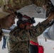 U.S. service members unload ordnance from aircraft participating in exercise Red Flag-Alaska