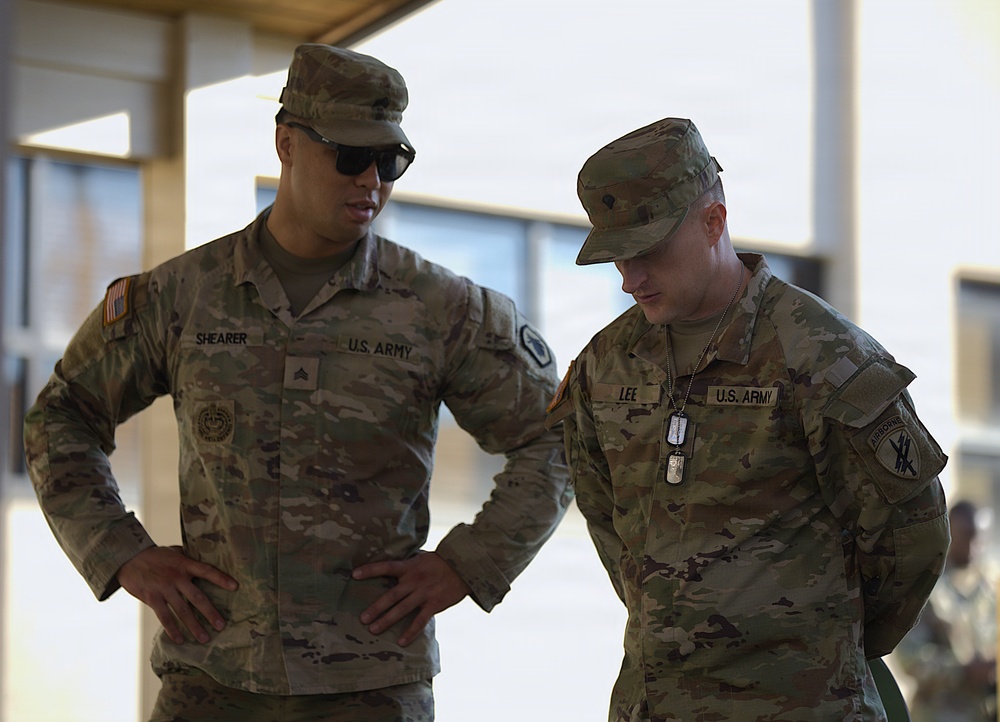 U.S. Army soldiers Shearer and Lee confer during military operations