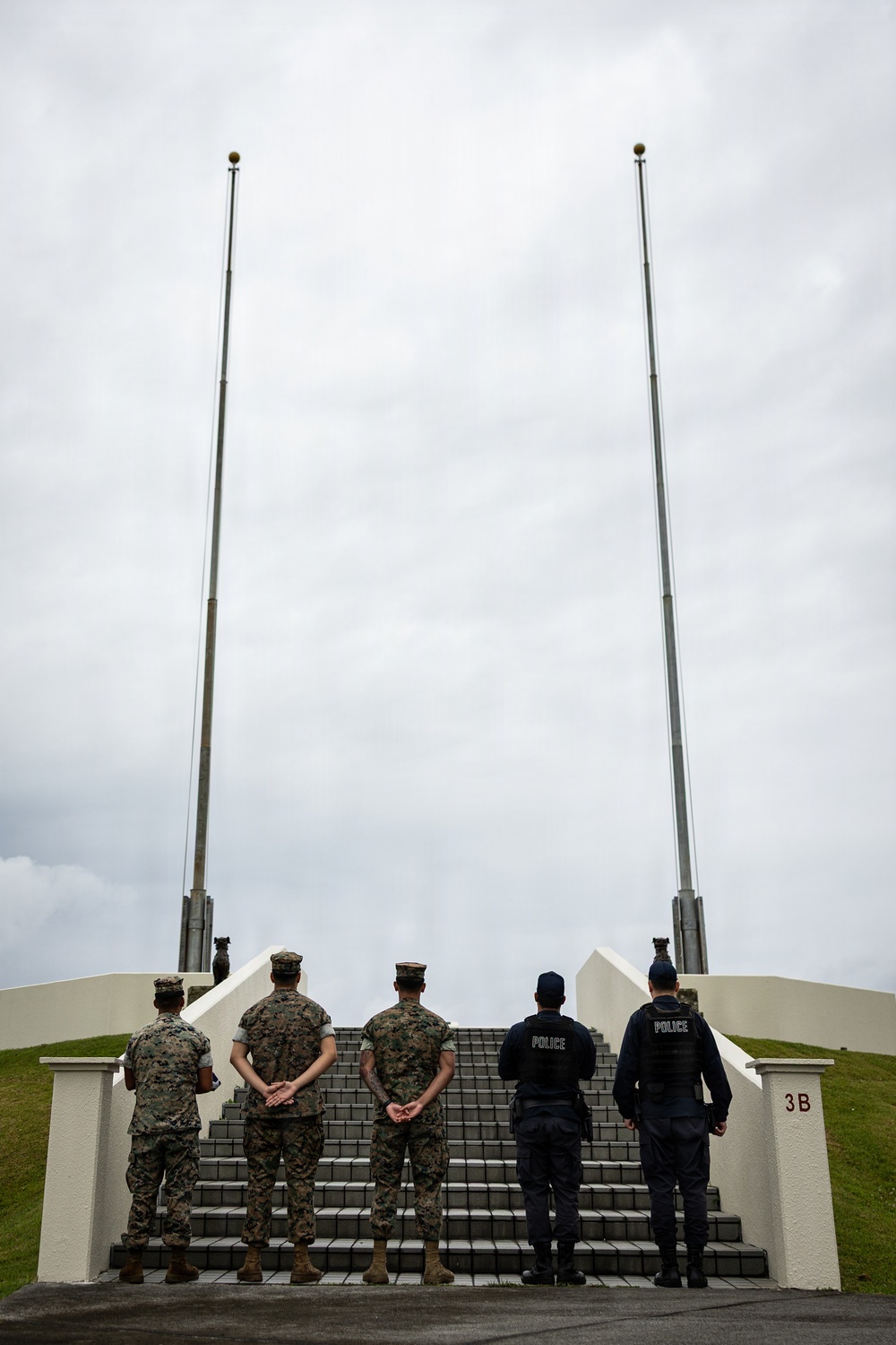 Marines and Japanese Base Security Forces raise the Colors at Camp Foster