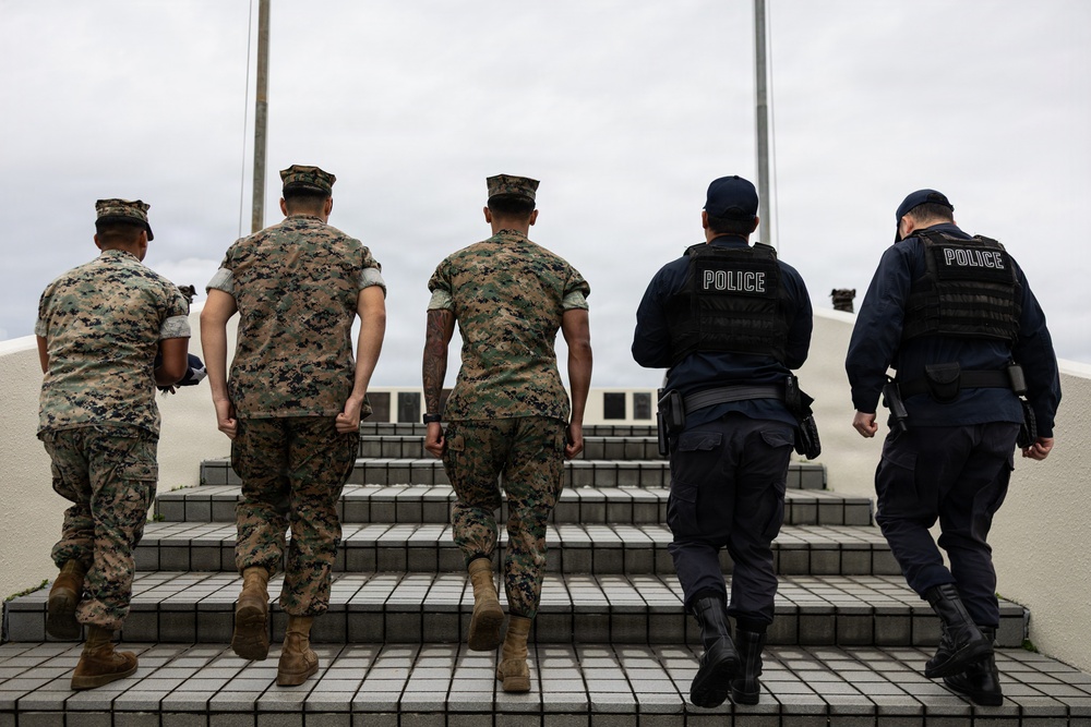 Marines and Japanese Base Security Forces raise the Colors at Camp Foster