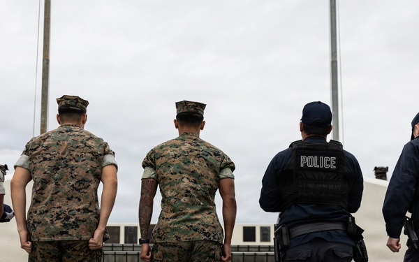 Marines and Japanese Base Security Forces raise the Colors at Camp Foster