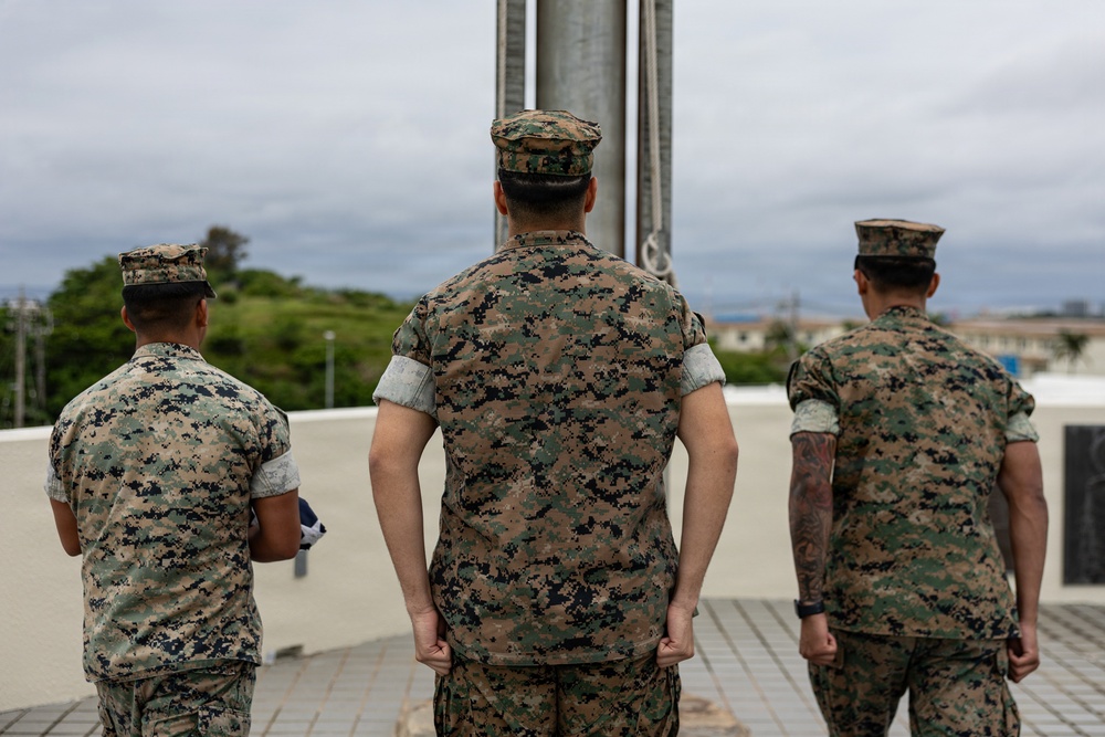 Marines and Japanese Base Security Forces raise the Colors at Camp Foster