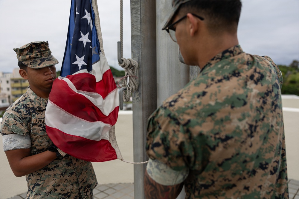 Marines and Japanese Base Security Forces raise the Colors at Camp Foster