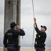 Marines and Japanese Base Security Forces raise the Colors at Camp Foster