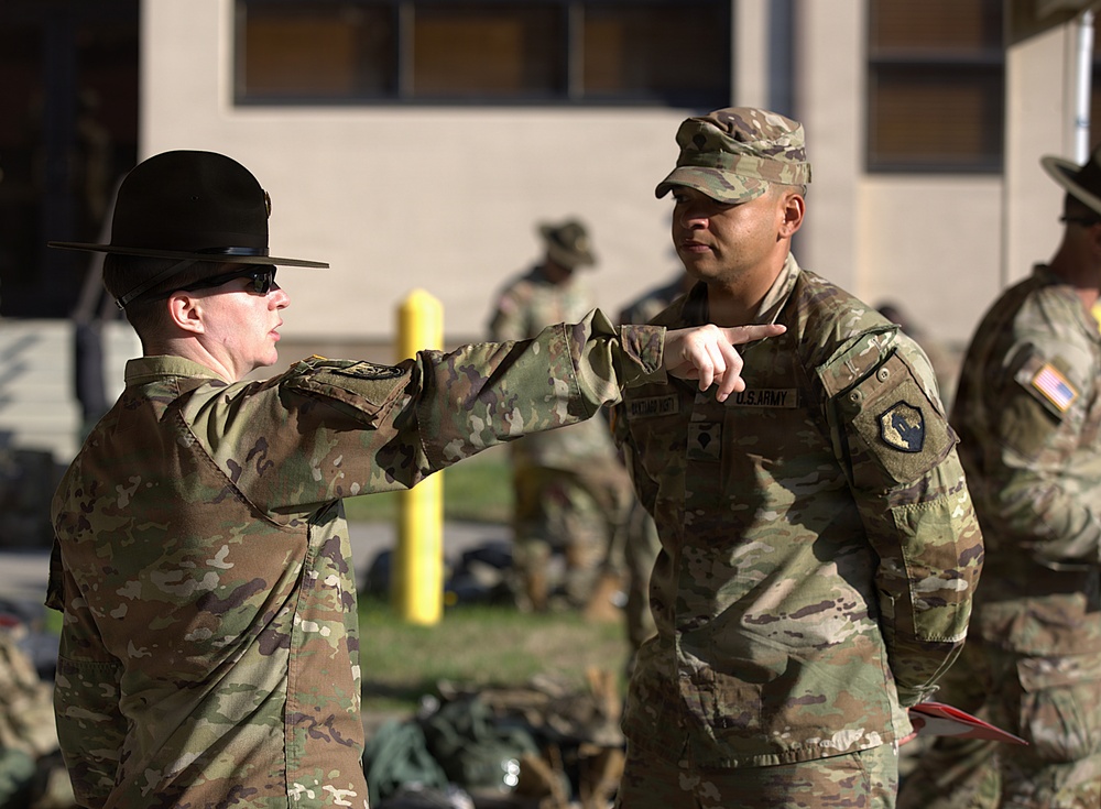U.S. Army drill sergeant instructs soldier during The Combined Best Squad Layout