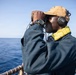 USS Mitscher (DDG 57) Sailor stands aft lookout watch on flight deck