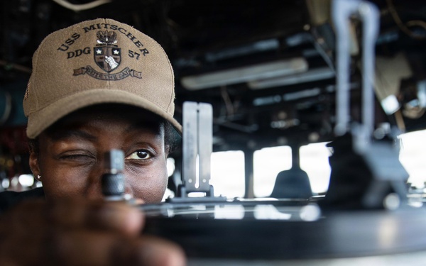 USS Mitscher (DDG 57) Sailor stands watch in ship bridge