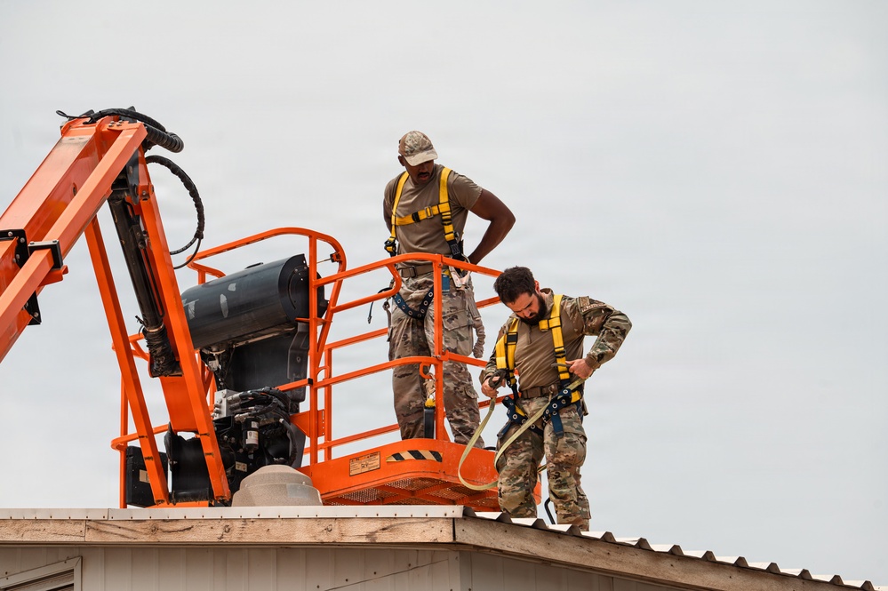 CE Airmen repair dorm roof