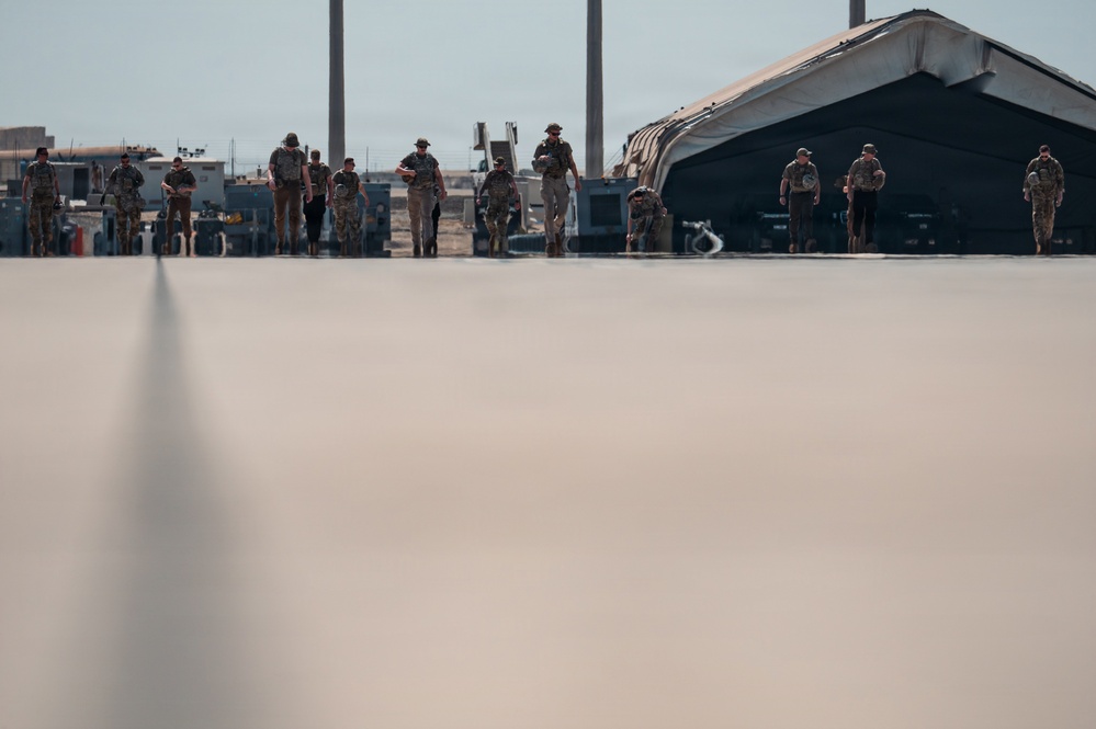 Refueling Squadron performs FOD walk and alarm drills