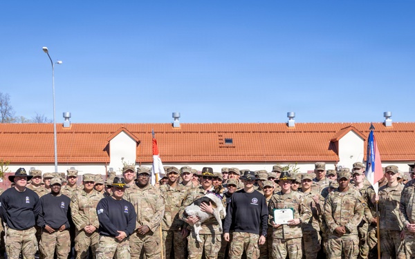 U.S. Soldiers of the NATO Forward Land Forces Battle Group-Poland award Chico the dog