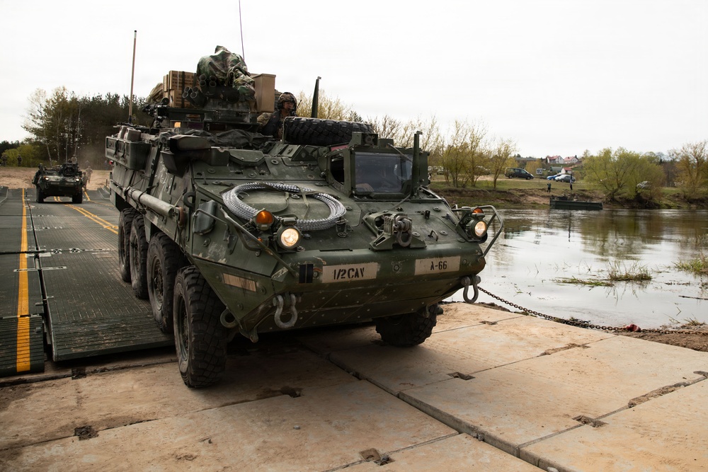 U.S. Soldiers traverse a wet gap crossing during Saber Strike