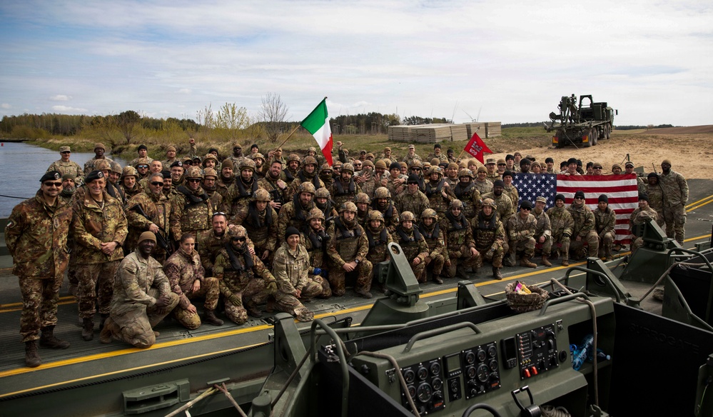 U.S. Soldiers traverse a wet gap crossing during Saber Strike