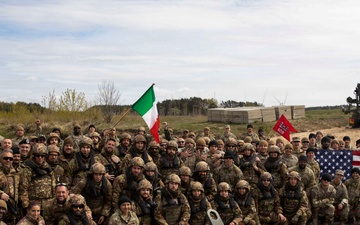 U.S. Soldiers traverse a wet gap crossing during Saber Strike