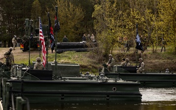 U.S. Soldiers traverse a wet gap crossing during Saber Strike