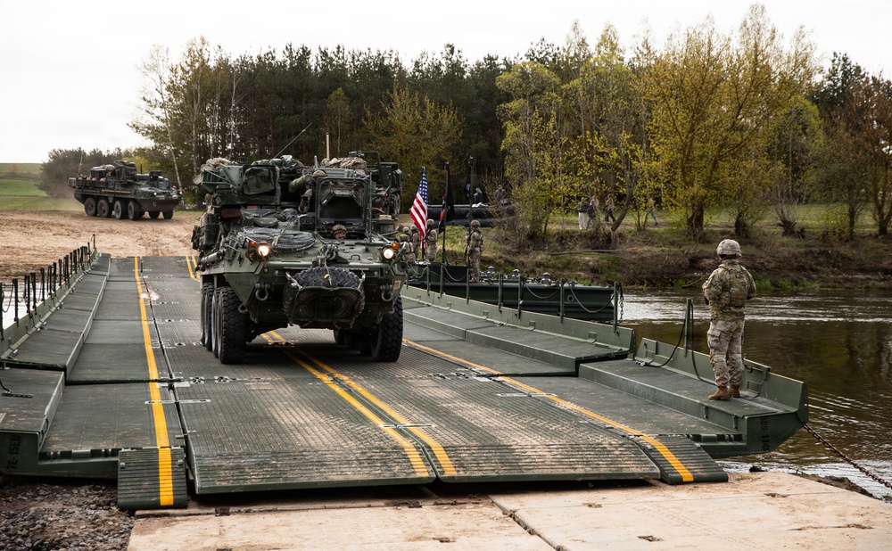U.S. Soldiers traverse a wet gap crossing during Saber Strike