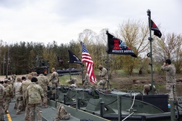 U.S. Soldiers from the 1st Squadron, 2d Cavalry Regiment, 809th Multi-Role Bridge Company, 15th Engineering Battalion, alongside Polish and Italian Armed Forces conduct a wet gap crossing