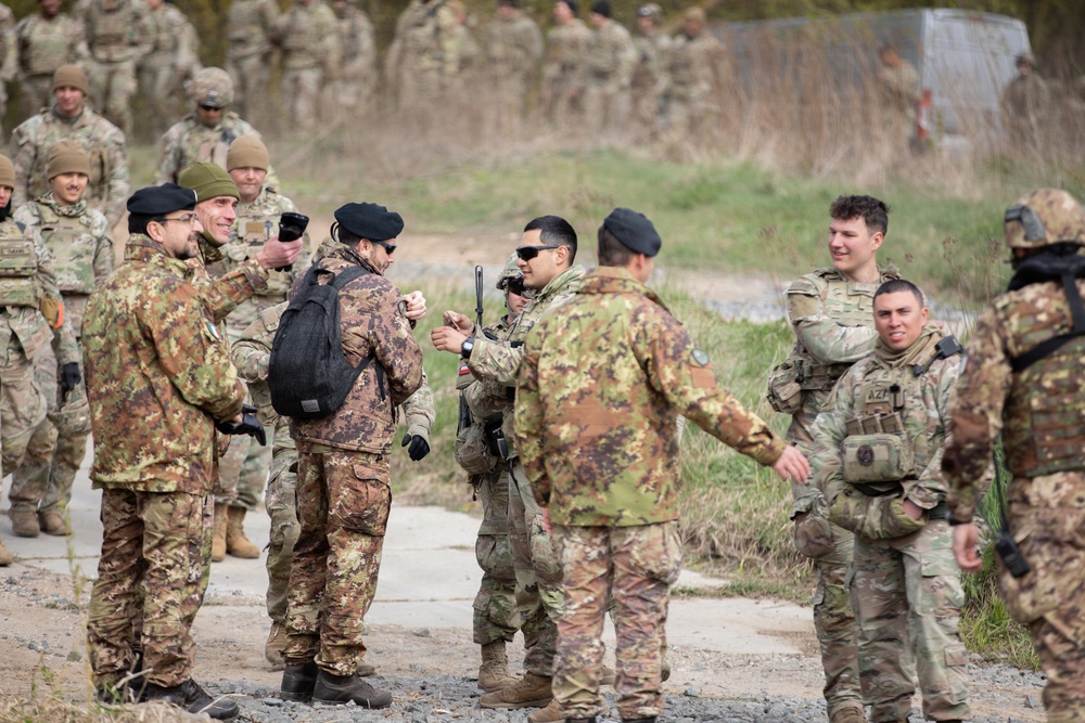 U.S. Soldiers from the 1st Squadron, 2d Cavalry Regiment, 809th Multi-Role Bridge Company, 15th Engineering Battalion, alongside Polish and Italian Armed Forces conduct a wet gap crossing