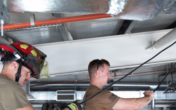 U.S. Army Firefighters conduct rappelling training