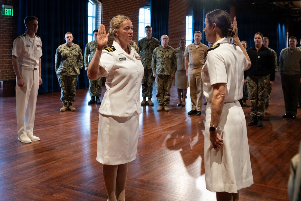 Navy Music promotes Commander Cartwright