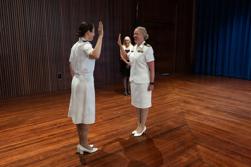Navy Music promotes Commander Cartwright