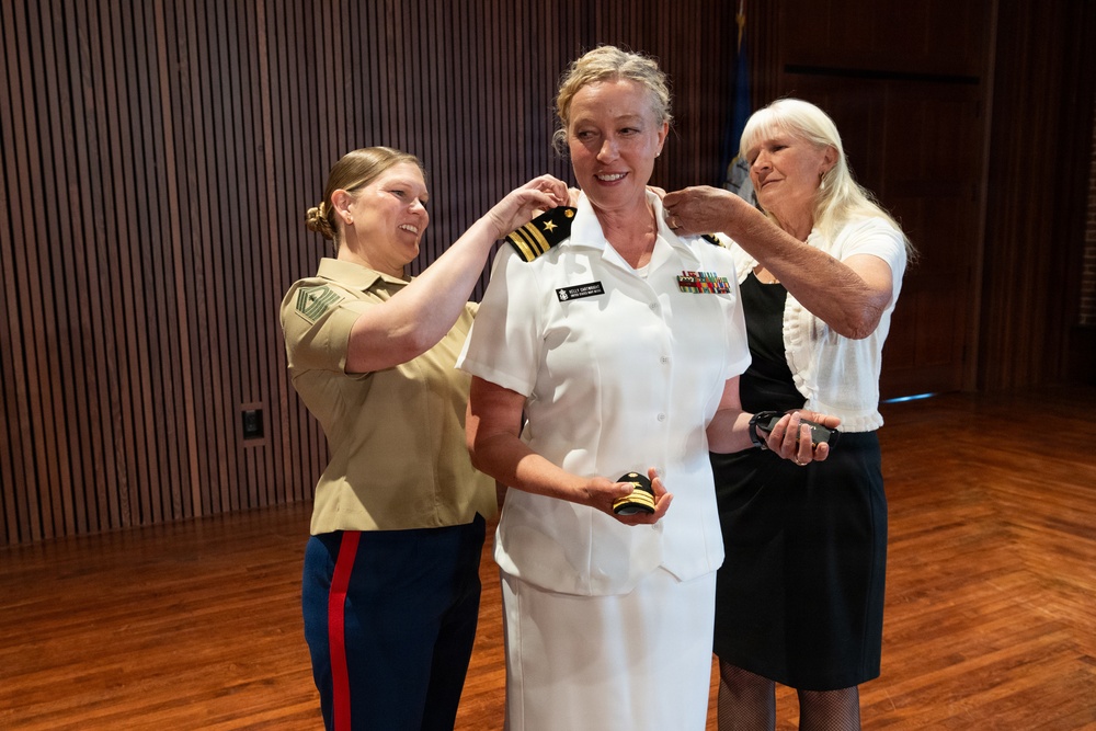 Navy Music promotes Commander Cartwright
