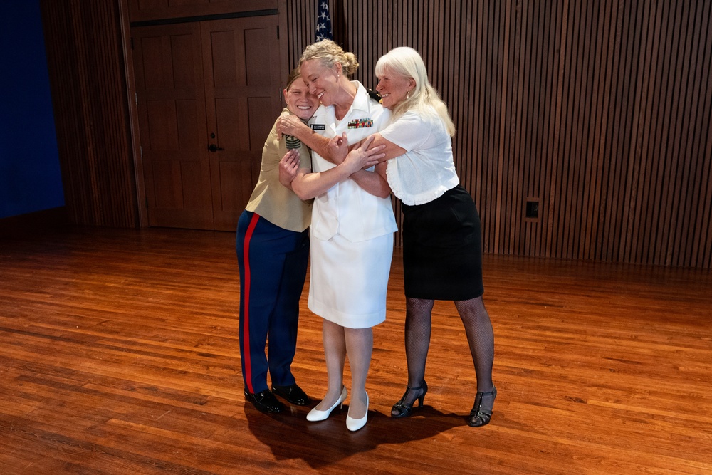 Navy Music promotes Commander Cartwright