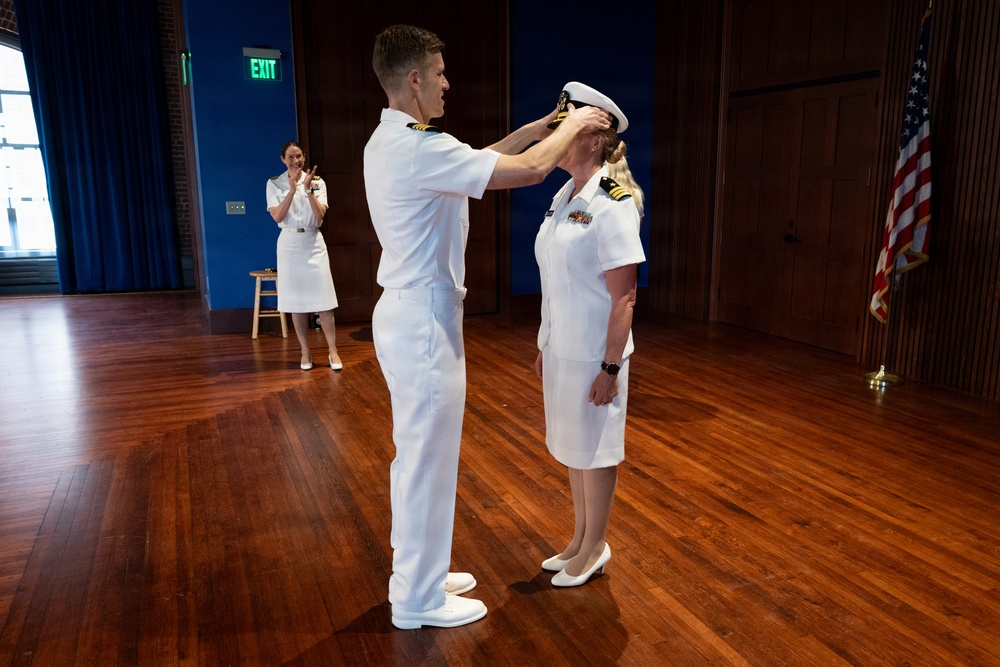 Navy Music promotes Commander Cartwright