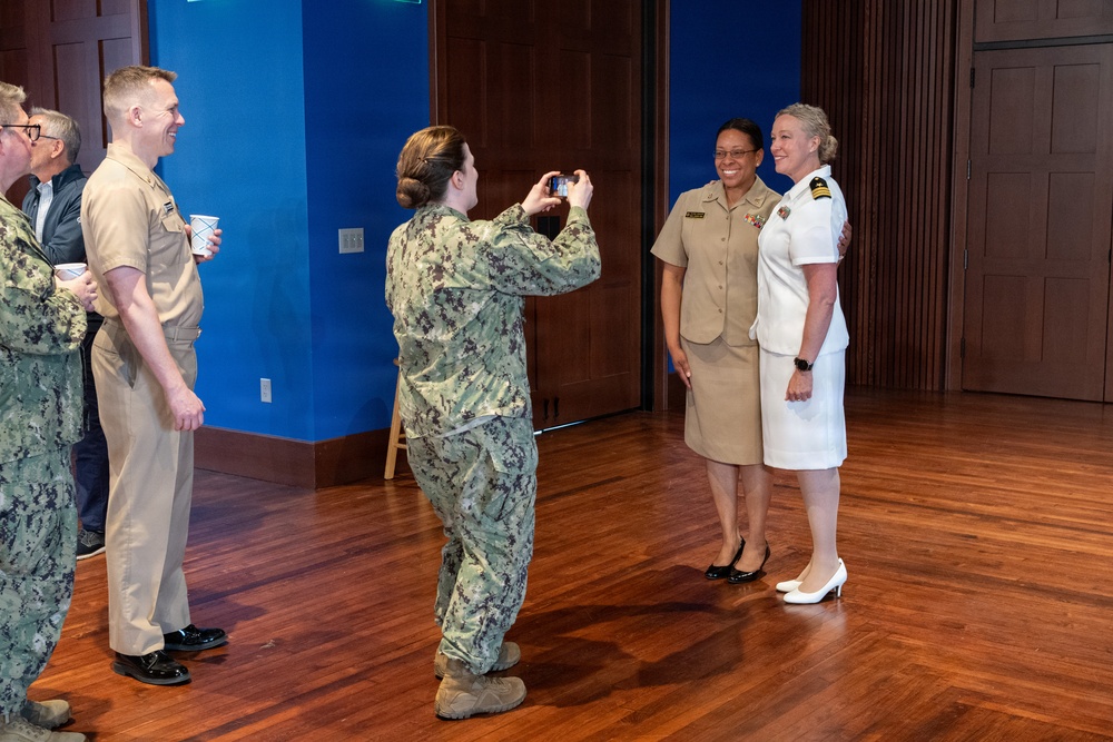 Navy Music promotes Commander Cartwright