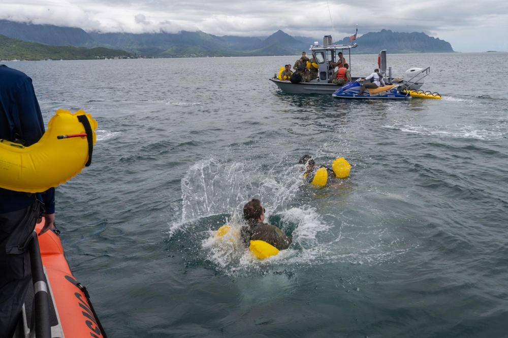 15 OSS SERE team conduct water survival training with Marine Corps