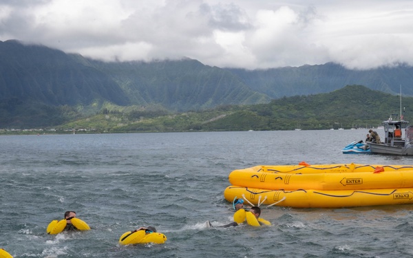 15 OSS SERE team conduct water survival training with Marine Corps