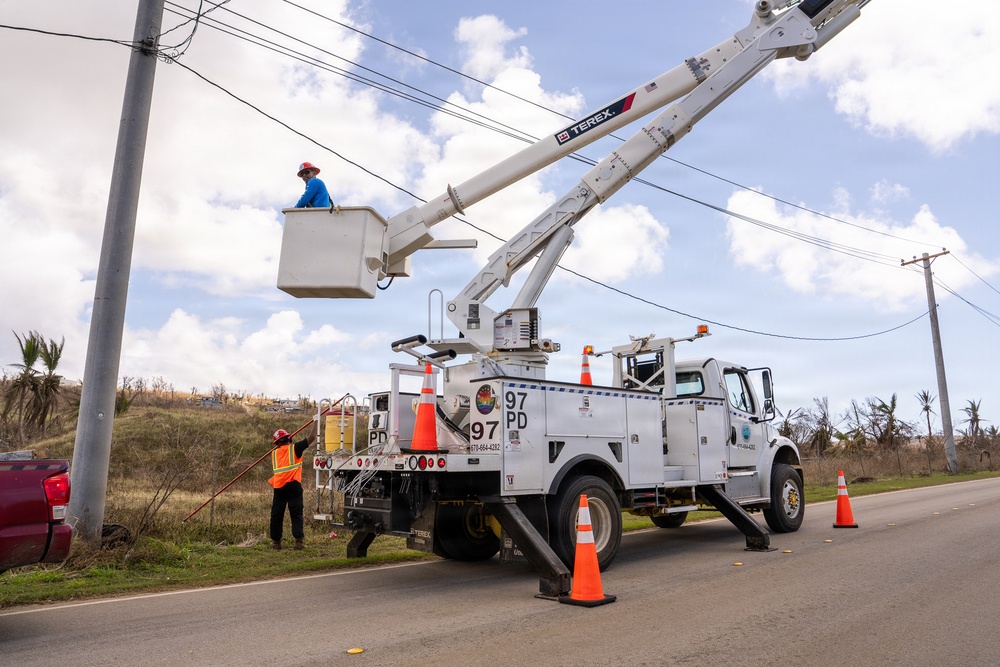 Linemen in Tinian Repair Power Lines