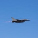 U.S. Marines and Sailors load ordnance on an F/A-18E Super Hornet