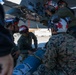 U.S. Marines and Sailors load ordnance on an F/A-18E Super Hornet