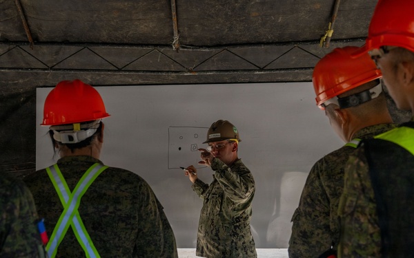NMCB 11 and Philippine Army conduct rapid airfield damage repair during BK26