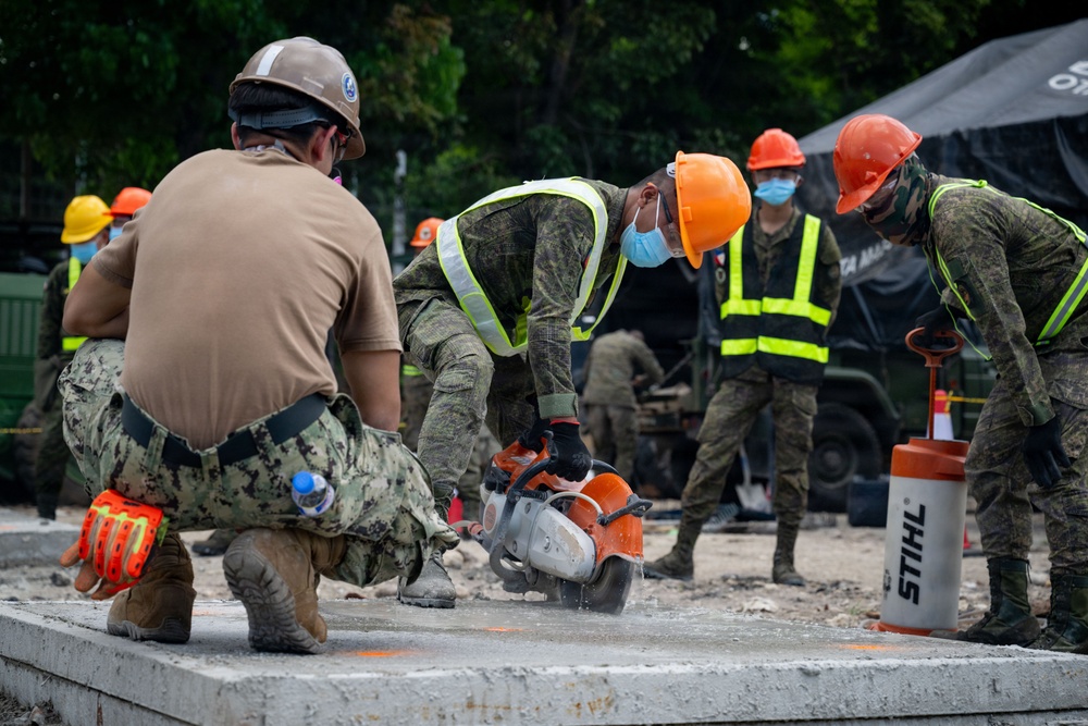 NMCB 11 and Philippine Army conduct rapid airfield damage repair during BK26