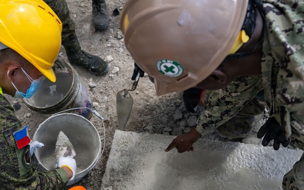 NMCB 11 and Philippine Army conduct rapid airfield damage repair during BK26