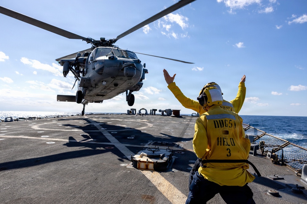 A MH-60R Seahawk of Helicopter Maritime Strike Squadron (HSM) 46 takes off from the flight deck of the USS Arleigh Burke (DDG 51)