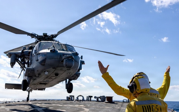 A MH-60R Seahawk of Helicopter Maritime Strike Squadron (HSM) 46 takes off from the flight deck of the USS Arleigh Burke (DDG 51)