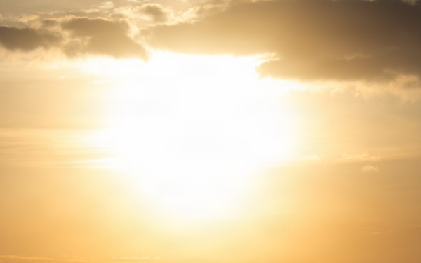 Destroyer Transits in Front of a Sunrise