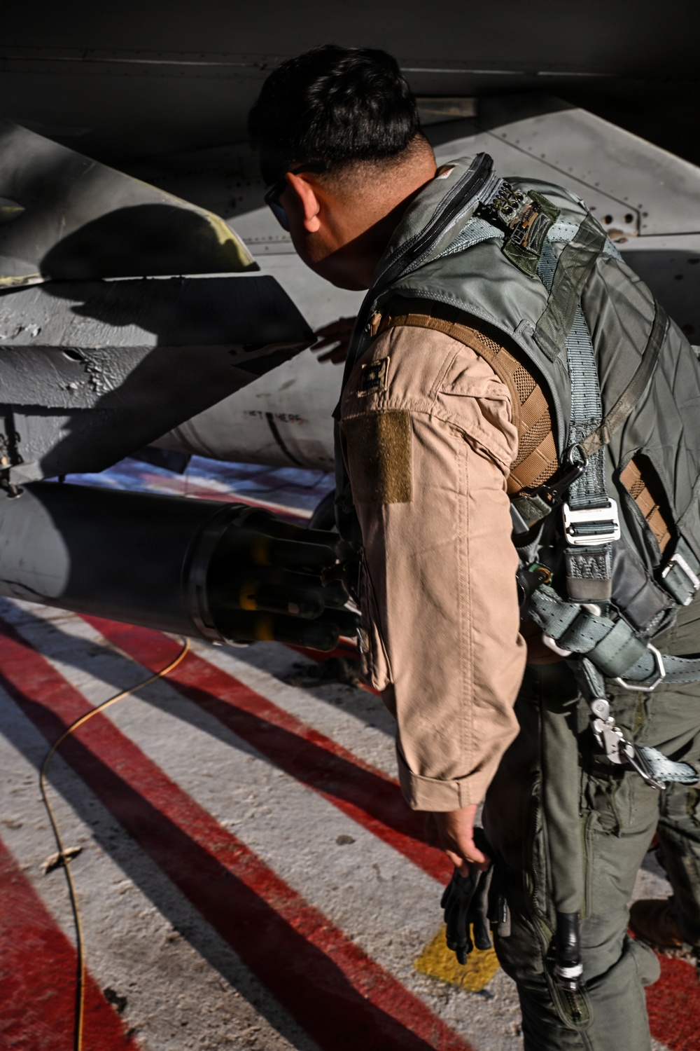 F-16 Fighting Falcon pilot conducts pre-flight inspections