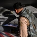 F-16 Fighting Falcon pilot conducts pre-flight inspections