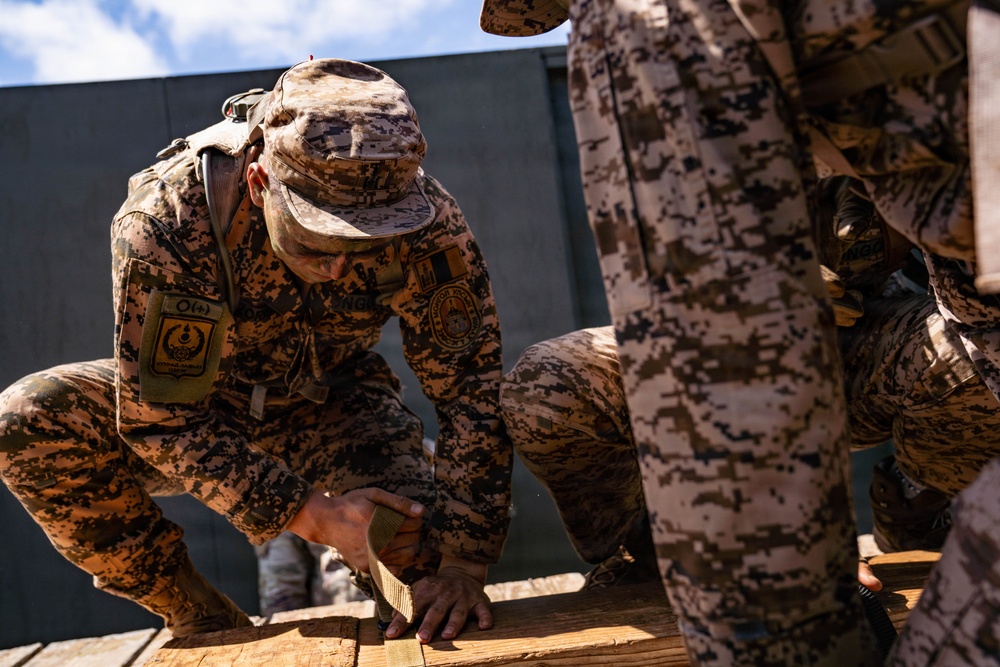 Multinational Soldiers take on the Leadership Reaction Course at the 2026 Pacific Land Forces Team Readiness Challenge