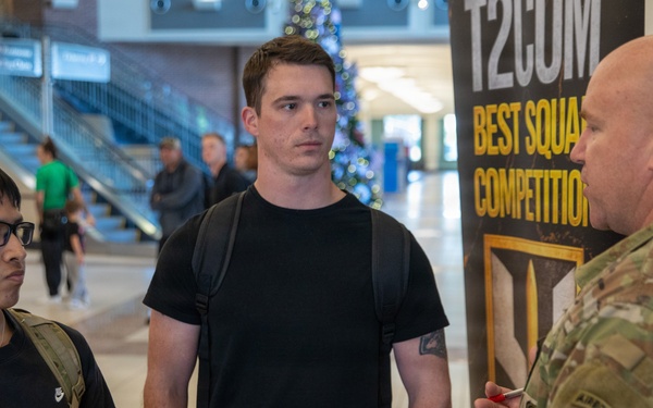 Army Soldier Speaks with Civilians at T2COM Best Squad Competition Event